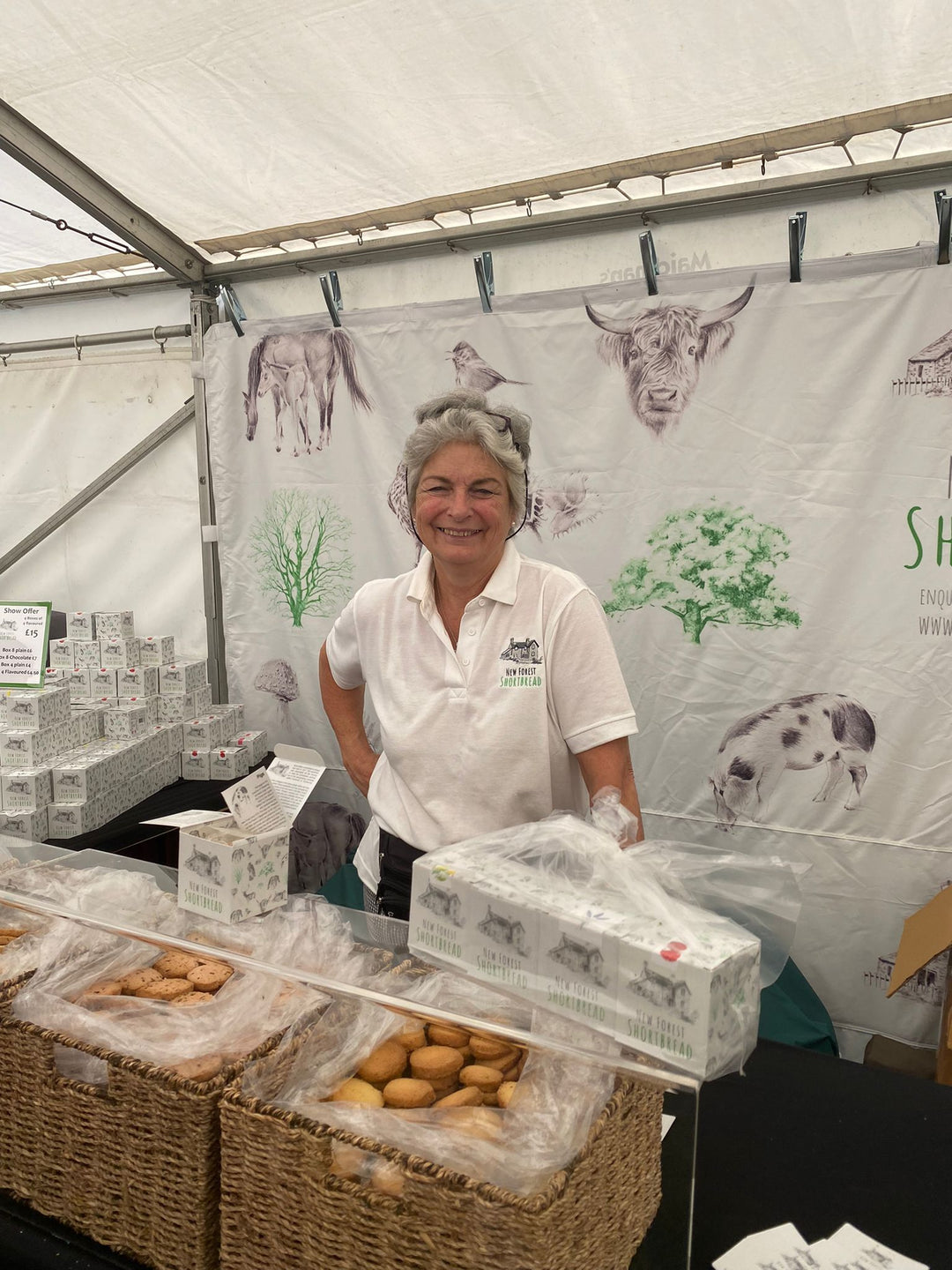 Tracy stood behind a New Forest Shortbread stand with shortbread to taste and buy 