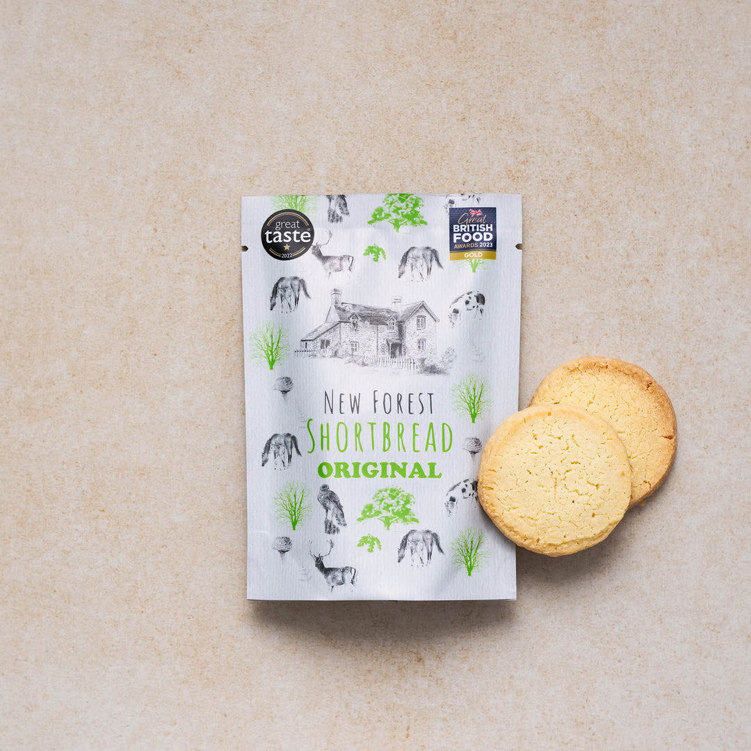 New Forest shortbread original snack pack with two shortbread cookies on a neutral backdrop
